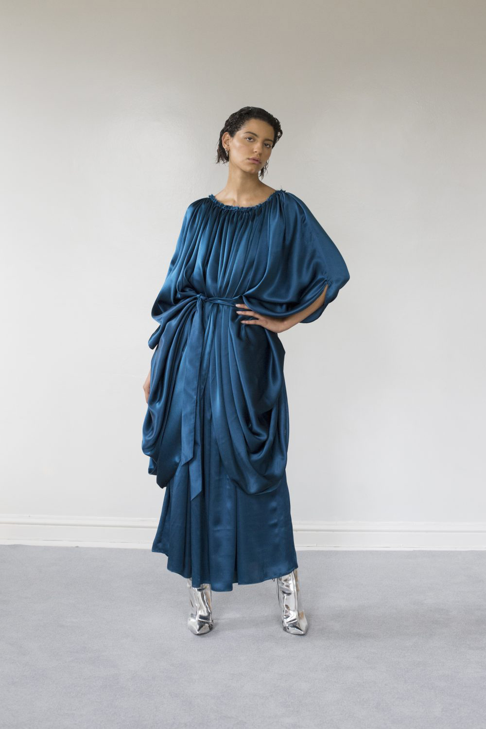 Draped blue satin dress with silver boots